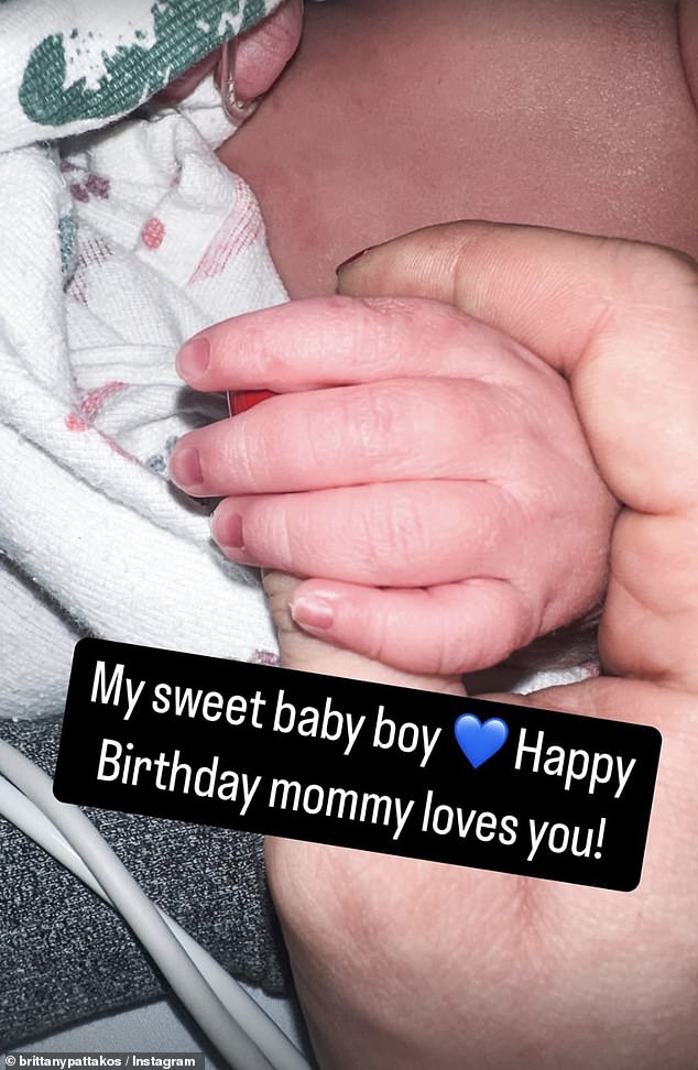 The new mom posted a close-up of her son's tiny hand wrapped in hers, writing, “My sweet baby boy. Congratulations. Mommy loves you!'