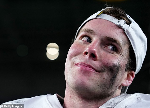 Riley Leonard #13 of the Notre Dame Fighting Irish reacts after defeating the Penn State Nittany Lions 27-24 in the Capital One Orange Bowl at Hard Rock Stadium on Thursday