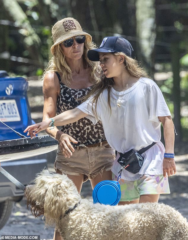 Her daughter India looked every bit like her mother's mini-me as she wore a white T-shirt and pink shorts during the dog walk