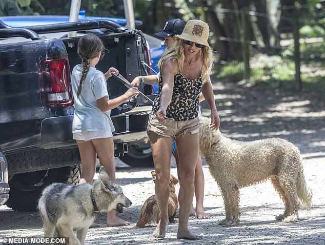 Elsa was seen treating her dogs as she picked up their German Shepherd - the newest addition to their clan