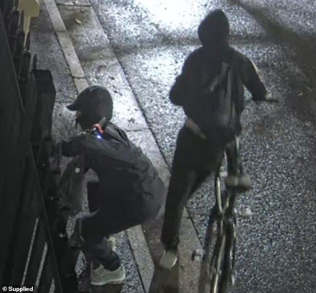 Police have since released CCTV footage of two hooded men seen outside the synagogue at around 4.25am on Saturday (pictured)