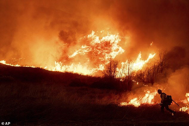 More than 100,000 residents of the City of Angels were forced to flee their homes and 10 died as scattered fires continued to crop up across Southern California; Kenneth Fire seen on January 9