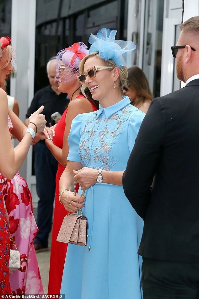 Zara completed her outfit with a matching fascinator and a pair of cream heels with a gold motif on the toe