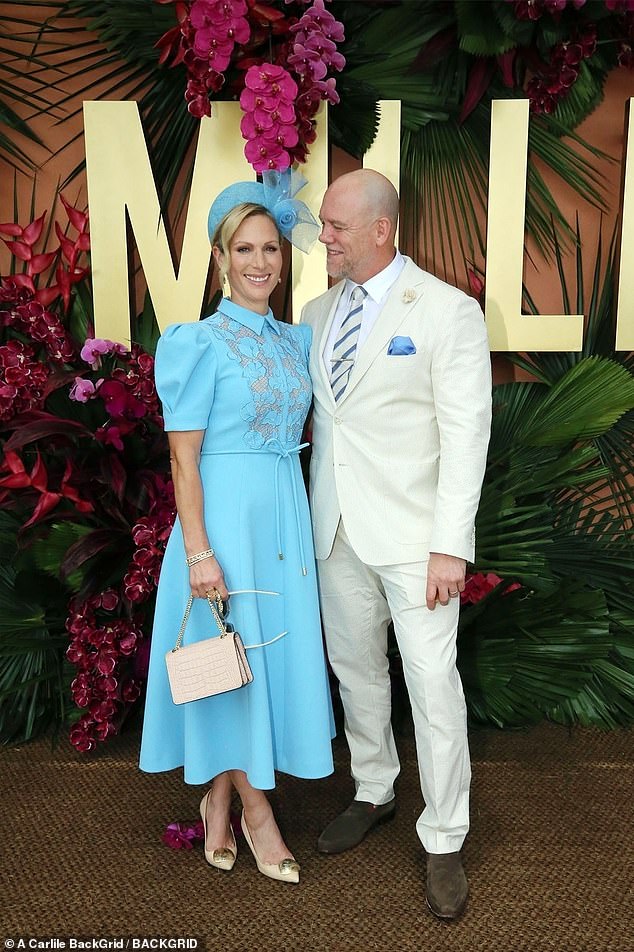 Mike, meanwhile, presented quite the dapper vision in a cream suit that complimented the shades of his wife's shoes and bag