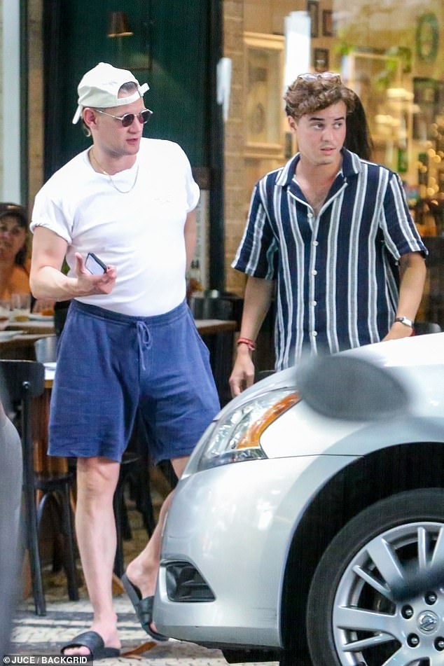 He completed the simple look with a white T-shirt, baggy blue shorts and black slippers