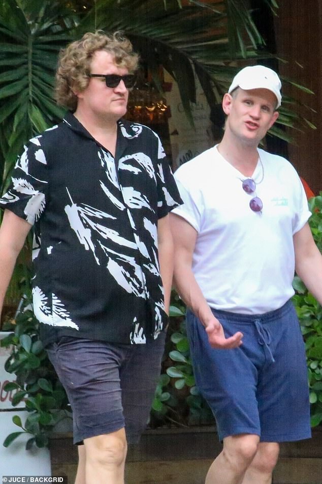 Matt looked deep in conversation with his friend as they took a walk together