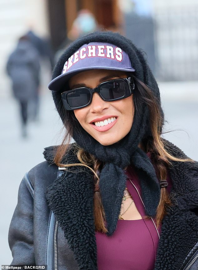 The former Hear'Say singer once again proved her impeccable fashion sense by adding a Skechers baseball cap, which she wore under a black scarf