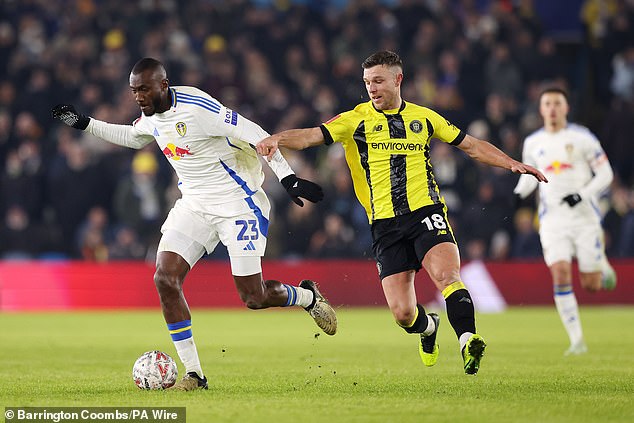 Leeds' Josuha Guilavogui looks to retain possession under pressure from Jack Muldoon