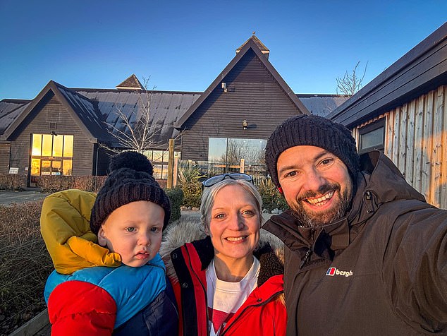 Edward Bull, 44, (pictured with his wife and son) witnessed the 'very sad' death of the zebra at Colchester Zoo yesterday afternoon, where the animal was brutally attacked by a rhino