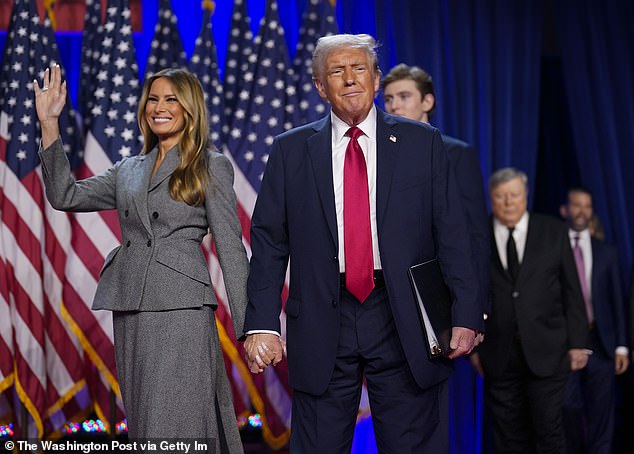 Trump walks on stage with his wife Melania after being declared the winner during an election night watch party at the Palm Beach County Convention Center in West Palm Beach