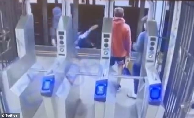 Shocking footage of the moment a man was pushed under a New York City subway train by a masked assailant who fled the scene