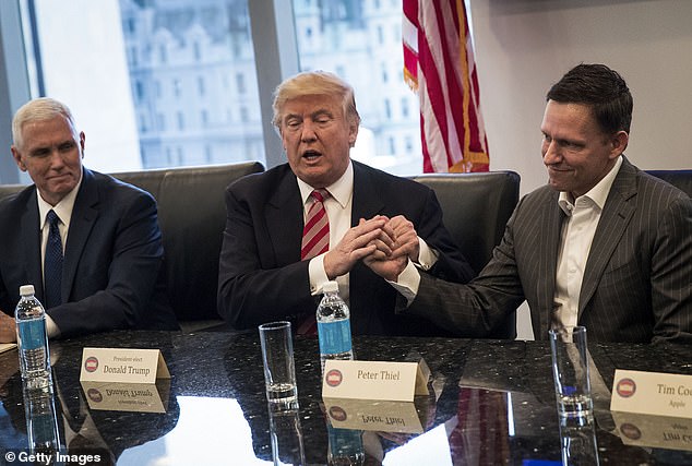 Trump shakes hands with Peter Thiel during a meeting with technology executives at Trump Tower, December 14, 2016 in New York City