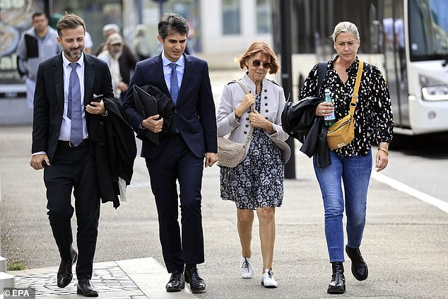 Gisele Pelicot (2-R), her daughter Caroline Darian (R) and her lawyers Stephane Babonneau (2-L) and Antoine Camus (L) walk towards the criminal court today