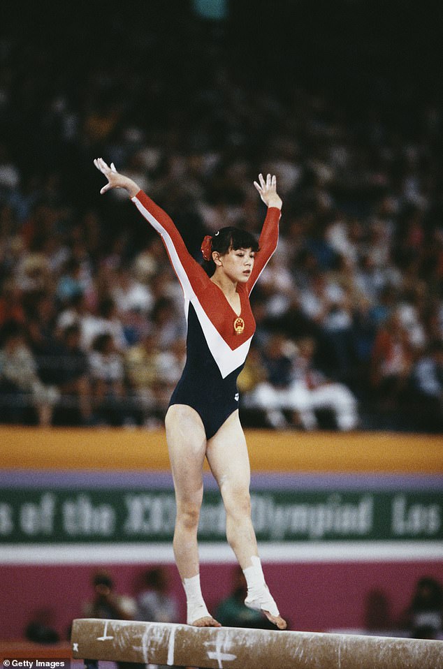 Wu Jiani performing at the Women's Balance Beam event at the 1984 Summer Olympics in Los Angeles