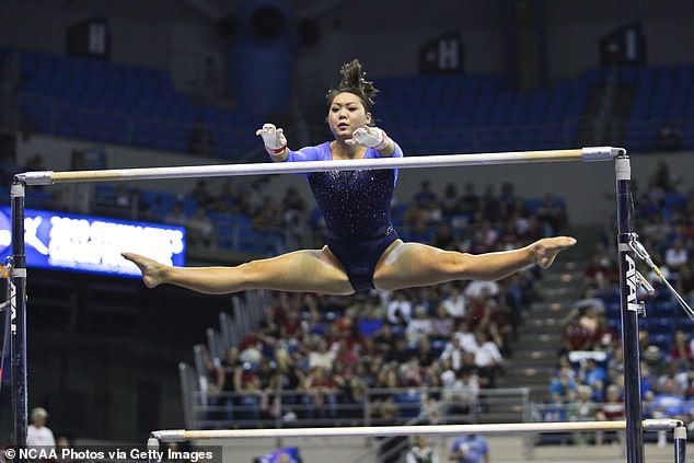 Li competes on the uneven bars during the Division I Women's Gymnastics Championship held at the University of Florida