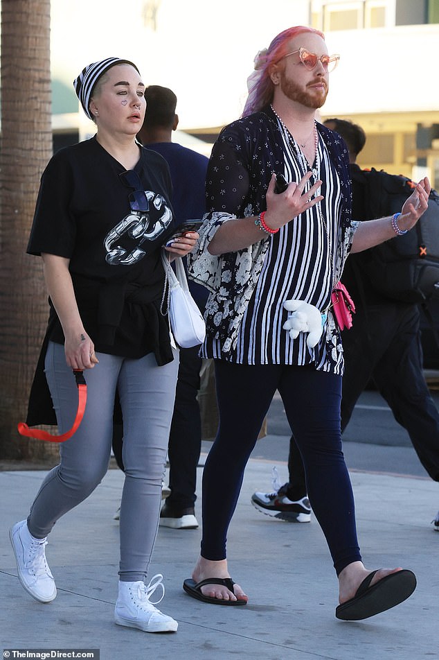 The former student beautician wore a black and white striped hat over her bleached hair