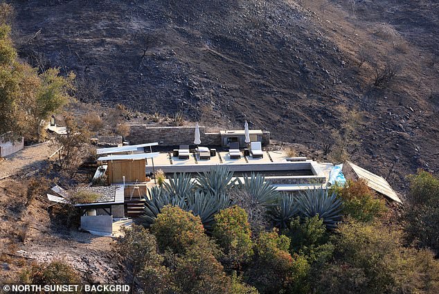 Parts of the backyard and pool are still intact, while the hills surrounding where the house once stood are also bare by the flames