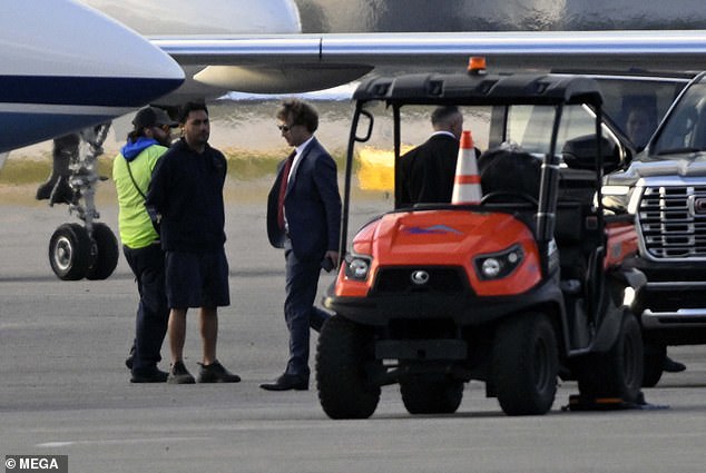 The tech titan was seen boarding his private jet, which was parked next to Trump's at the airport, in Palm Beach, Florida, after the Mar-a-Lago rally