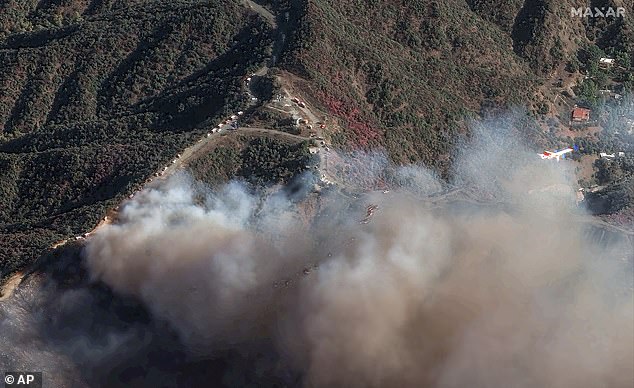 The Palisades Fire is burning south of the Encino Reservoir in Los Angeles on Saturday