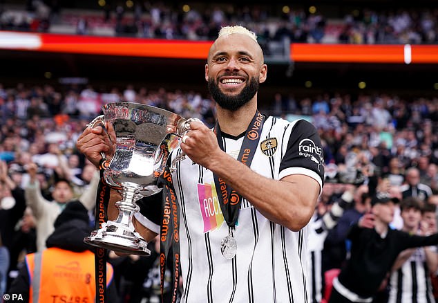 John Bostock celebrates winning the National League play-off final with Notts County in 2023