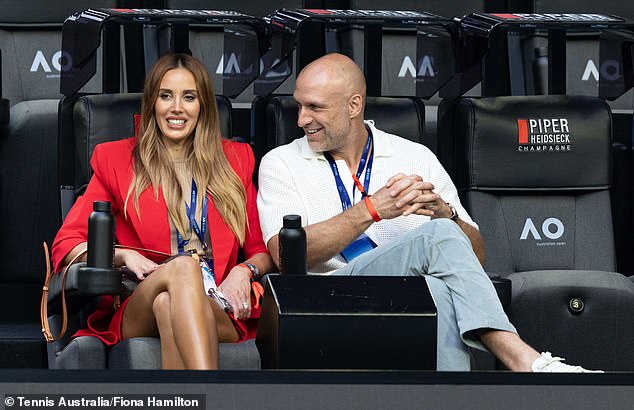 The WAG attended the Australia Open on Sunday evening with her husband Chris Judd (right).