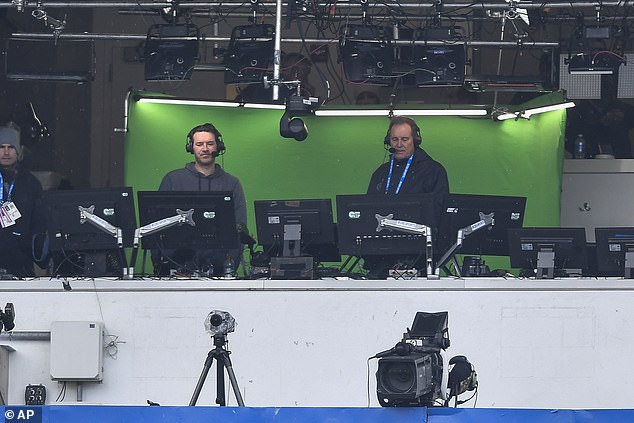 Romo and Nantz are in the booth preparing for their call at Highmark Stadium in Buffalo