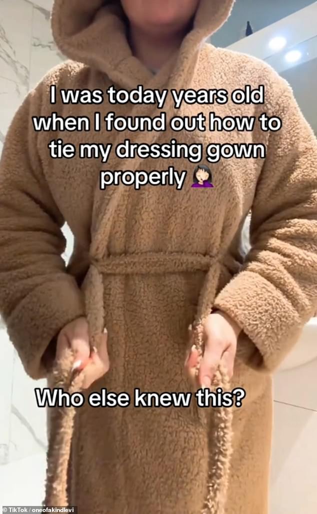 Via TikTok, British creator Levi-Mariah (pictured) shared the 'correct' way to tie a bathrobe, which guarantees a draught-free evening