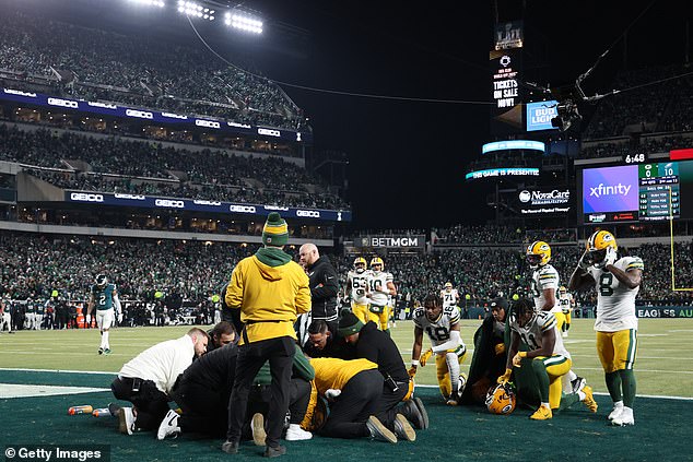 Doubs' concerned teammates knelt as Green Bay coaches tended to him