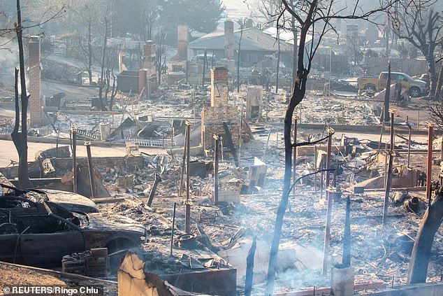 Officials have confirmed 16 deaths and more than 105,000 residents remain under evacuation orders as damage and economic loss are estimated to cost between $135 billion and $150 billion (Eaton Fire pictured Saturday)