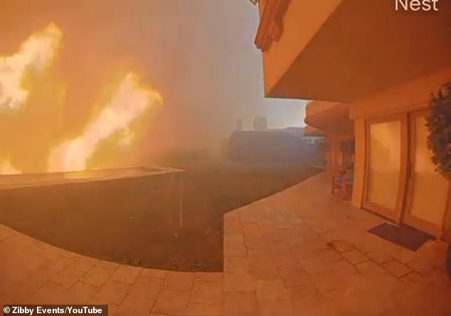 The footage shows a fireball growing and stretching into the sky just beyond their infinity pool