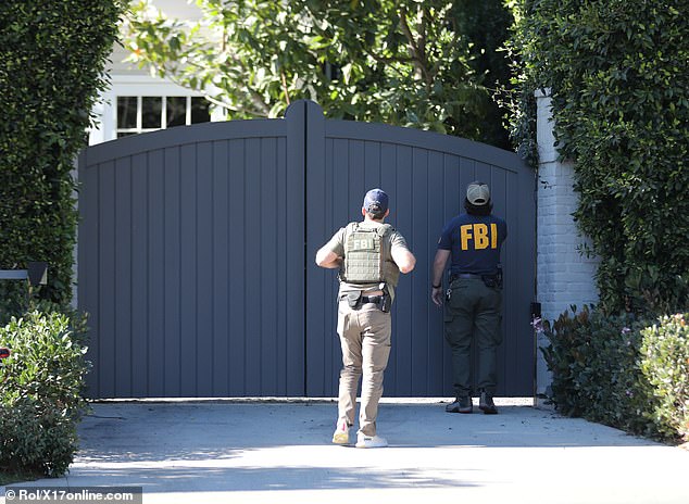 The officers were waiting outside the gate of Ben's driveway, and someone appeared to be shouting over it