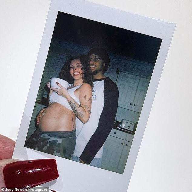 The pair reportedly split in September, but in the loved-up photo, Zion posed with his hand on the singer's stomach as she wrote that she is now 