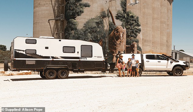 Alison Pope, her husband and their three children are pictured with their previous caravan