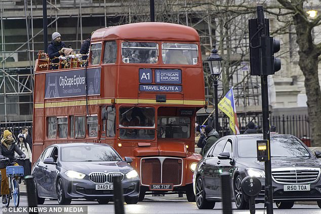 Motorists and cyclists were seen riding alongside the bus, oblivious to the action taking place on board