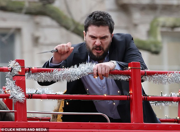 The bearded actor leered at the audience while waving the weapon as the scene progressed