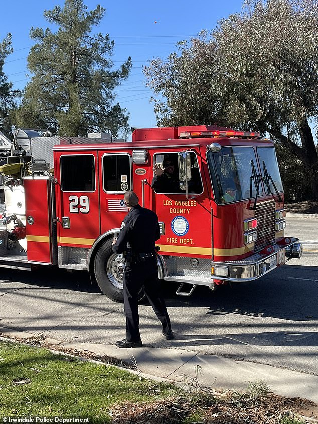 Firefighters were responding to a small bushfire in Irwindale when they witnessed Ruben Montes, 29, 'actively lighting fires' in the area. Firefighters are pictured at the scene