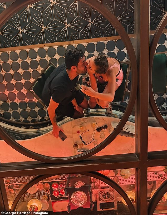 The Love Island star, 30, openly showed how smitten she was with her new boyfriend as she leaned in for a passionate smooch in a mirror selfie with the hunk in one steamy snap