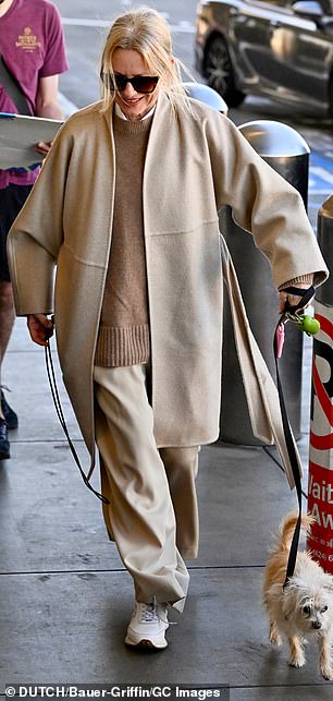 The 56-year-old Feud producer-star was comfortably dressed in soft beige and brown clothes and shiny white sneakers