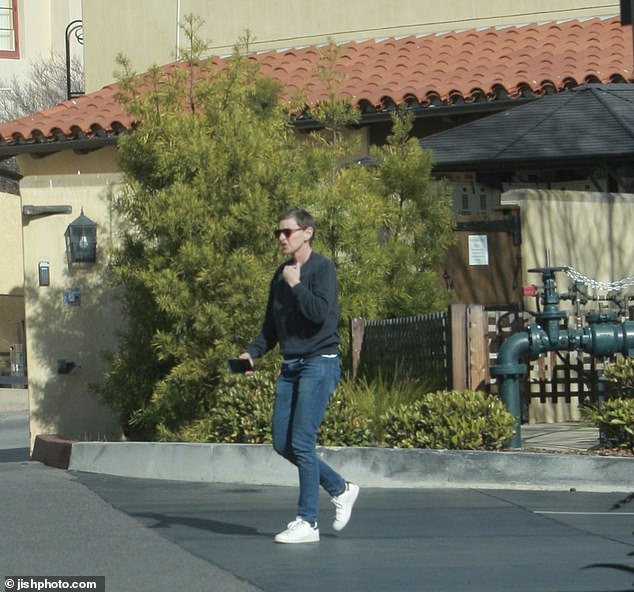 Dressed casually in a gray crew-neck sweater, blue jeans and sneakers, DeGeneres was seen pulling into a visitor's parking lot before entering a residents' building at Casa Dorinda.