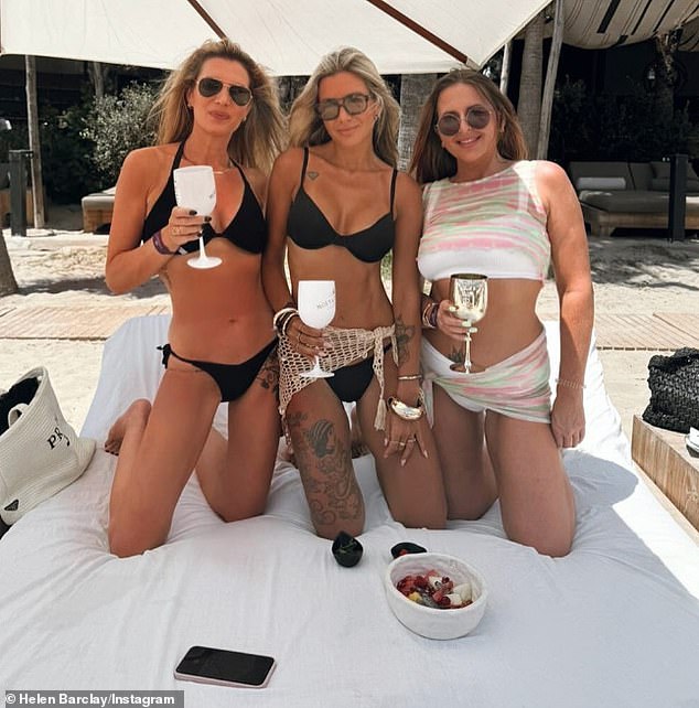 Helen (centre) poses with two friends for an undated Instagram photo during a beach holiday abroad