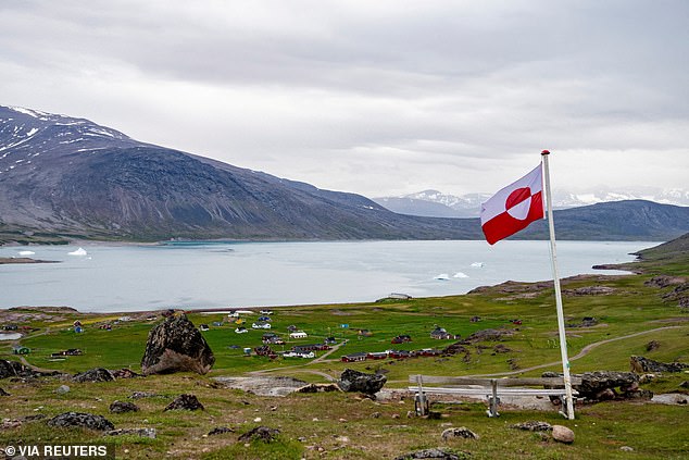 The Greenlandic flag flies in the settlement of Igaliku, Greenland, July 5, 2024