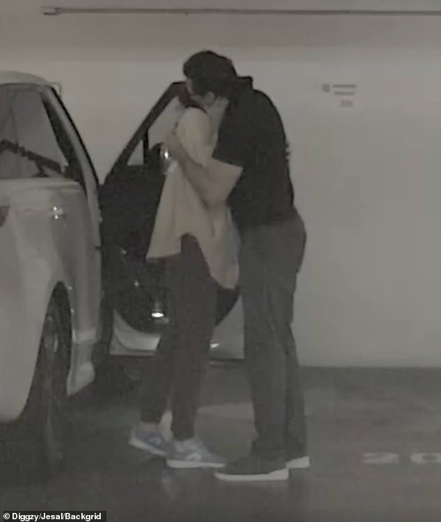 Jackman passionately embraced his new love as they got out of the car