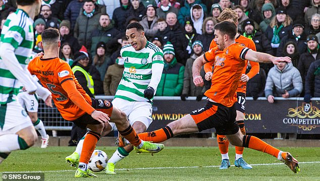 The Irishman is taken out by a trio of Dundee United defenders in the 0-0 draw at Tannadice