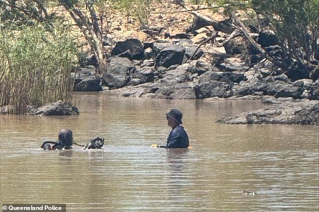 Emergency services rushed to Beardmore Dam in St George, south-west Queensland, after a man was reported missing on Sunday afternoon (police divers are pictured)