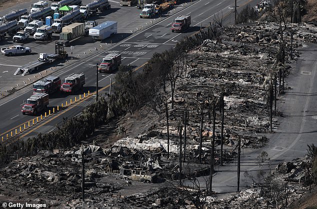 As destruction grew in the affluent neighborhood, Kai Rochester began working with firefighters after defying evacuation orders to stay behind to protect homes.