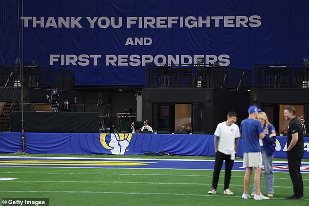 Signs thanking emergency responders hung in the stands at State Farm Stadium