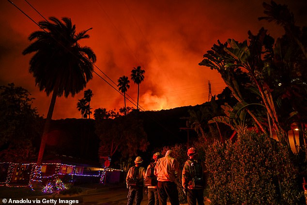 A view of a forest fire as firefighting planes and helicopters drop water over the flames in Mandeville Canyon during 'Palisades Fire' in Los Angeles, California, United States on January 10, 2025