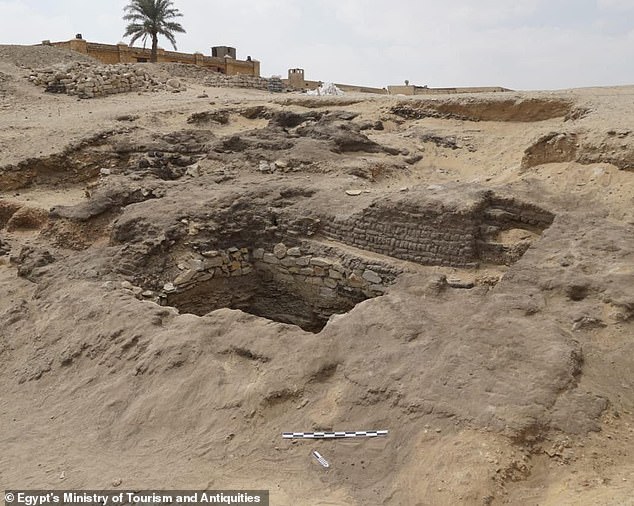 Additional partially visible entrance leading to underground tunnels and interconnecting networks to tombs decorated with ancient Egyptian hieroglyphs leading to burial chambers.