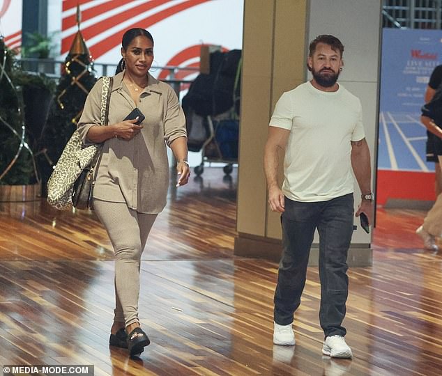 Paulini looked stylish in tight beige trousers and a matching top, but it was the dazzling accessory on her left hand that turned heads