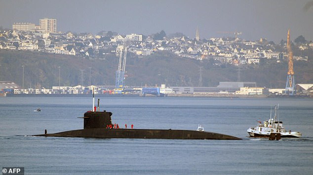 A nuclear submarine leaves the port of Brest, where the l'Île Longue naval base is located